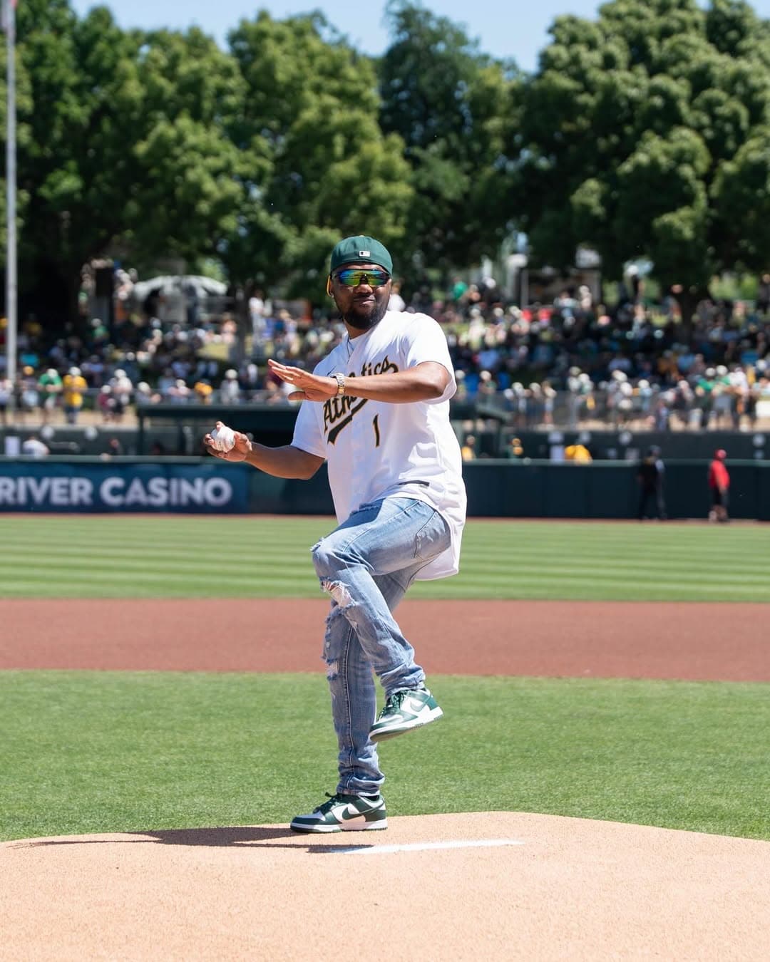 Throwing the ceremonial first pitch for the Athletics